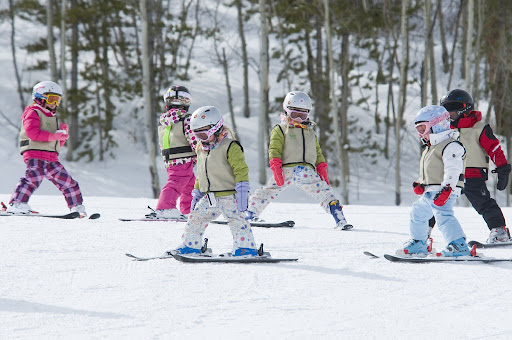 Which one is better for children: skiing vs snowboarding?